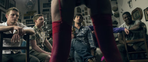 Through the legs of the stripper